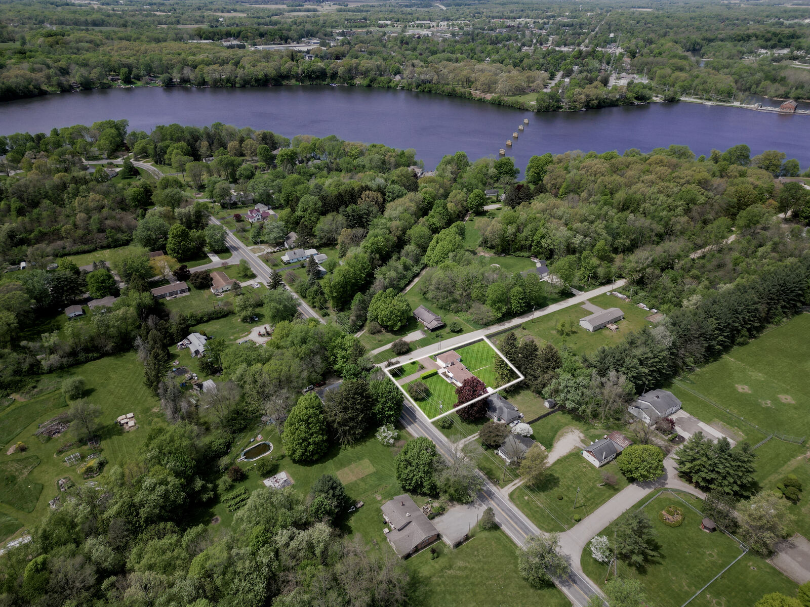 Aerial neighborhood photo with property outlined