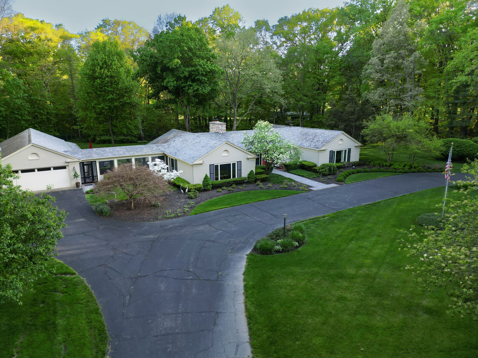 Aerial photo of ranch home with circular driveway