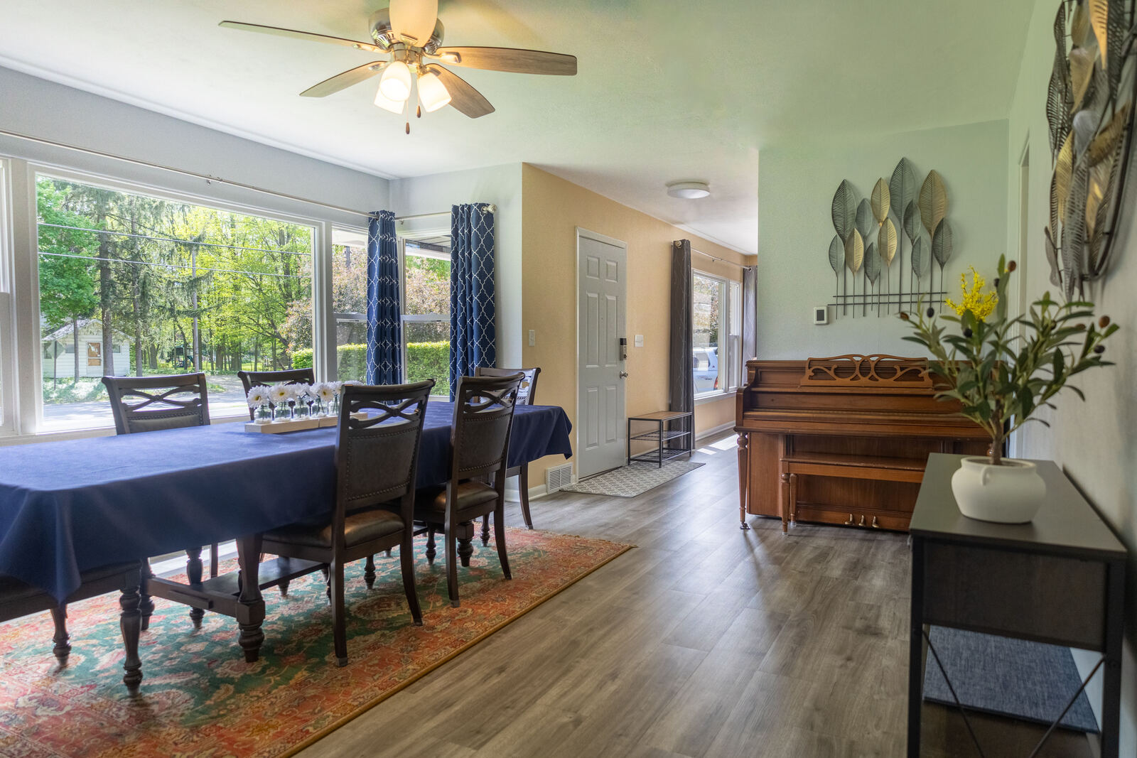 Dining room with long table and piano
