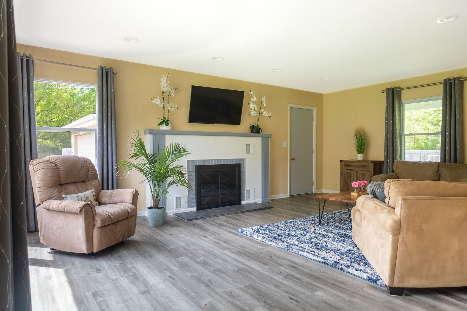 Living room with fireplace and TV
